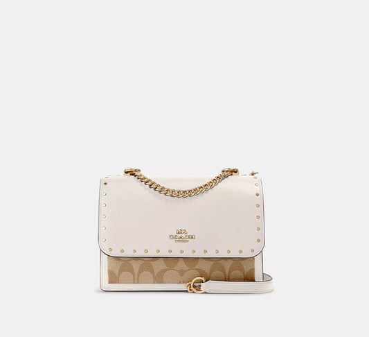 Coach Klare Crossbody In Signature Canvas With Rivets gold